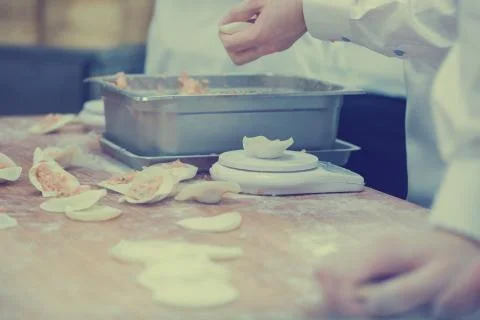 Dim Sum chefs working wrapping dumplings at famous restaurant in Taiwan. Stock-Fotos