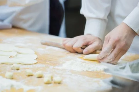 Dim Sum chefs working wrapping dumplings at famous restaurant in Taiwan. Stock Photos
