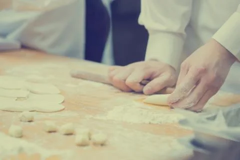 Dim Sum chefs working wrapping dumplings at famous restaurant in Taiwan. Stock Photos