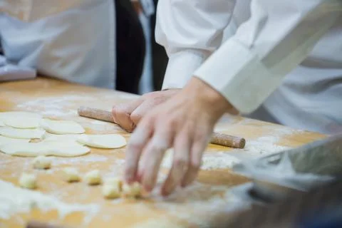 Dim Sum chefs working wrapping dumplings at famous restaurant in Taiwan. Stock Photos