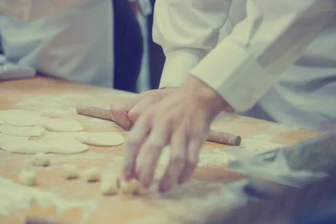 Dim Sum chefs working wrapping dumplings at famous restaurant in Taiwan. Stock Photos