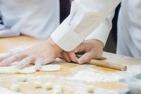Dim Sum chefs working wrapping dumplings at famous restaurant in Taiwan. Stock Photos