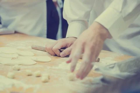 Dim Sum chefs working wrapping dumplings at famous restaurant in Taiwan. Stock Photos