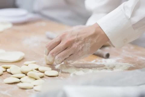 Dim Sum chefs working wrapping dumplings at famous restaurant in Taiwan. Stock Photos
