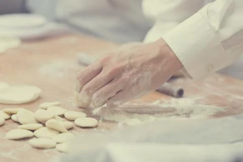 Dim Sum chefs working wrapping dumplings at famous restaurant in Taiwan. Stock Photos