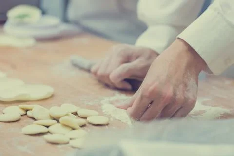 Dim Sum chefs working wrapping dumplings at famous restaurant in Taiwan. Stock Photos