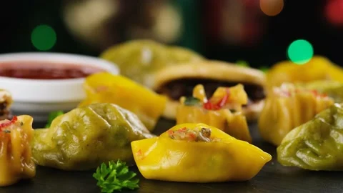 Dim Sum dumplings and Bao buns on rustic stone board. Traditional Chinese food Stock Footage 164533087