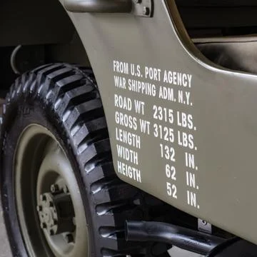 Dimensions and weights printed on the side of a military off road. 库存照片