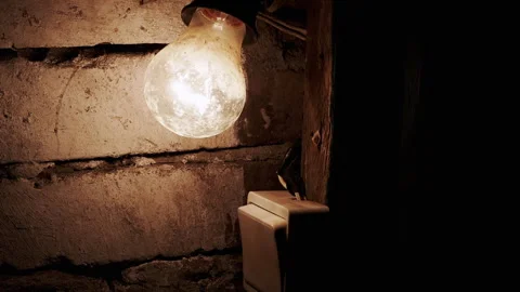 Dimly Lit Bulb and a Switch Stock Footage 293152725