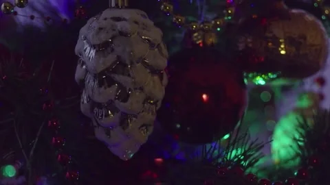 Dimly Lit Christmas Tree With Beaded Garlands and Colorful Ornaments in Night Video stock 329558044