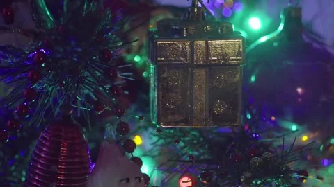 Dimly Lit Christmas Tree With Beaded Garlands and Colorful Ornaments in Night Stock Footage 329558053