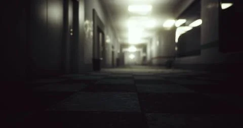 Dimly lit corridor with blurred perspective in an abandoned building Ilustración de archivo