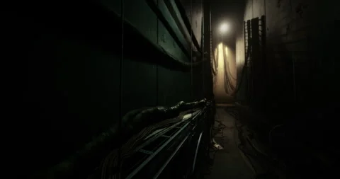 Dimly lit corridor with cables in a dark industrial space during evening Stock Footage 311808153