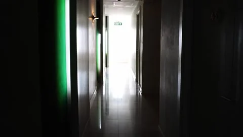 Dimly lit corridor inside the hotel to enter the rooms Stock Footage 278406974
