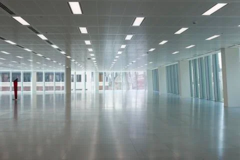 Dimly Lit Empty Office Building Interior with View of Outdoors Stock Photos