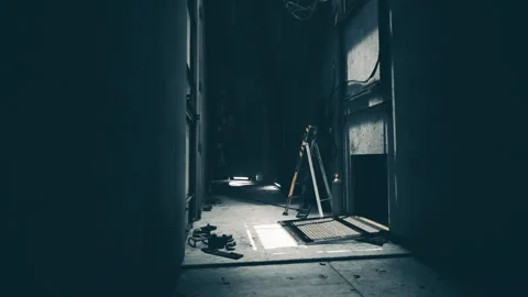Dimly lit hallway with tools and scattered debris in an industrial setting Stock Footage 331422332