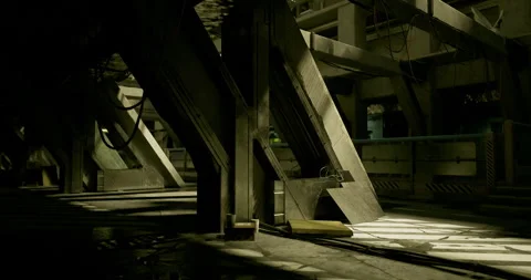 Dimly lit industrial corridor with sharp architectural lines and shadows Stock Footage 313783009