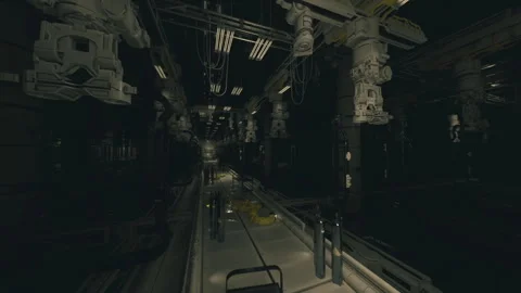 Dimly lit industrial hallway featuring suspended gear and tangled wiring Stock Footage 341580905