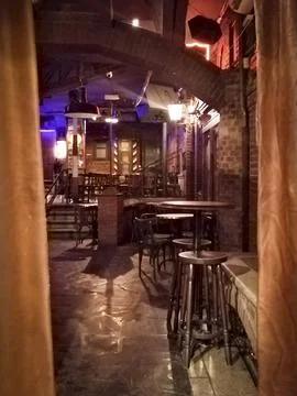 Dimly lit interior corridor of a rustic pub in salamanca spain Stock Photos