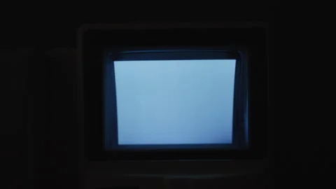 Dimly Lit Screen Of An Old Intercom With A Flickering Blue Glow In A Dark Room, Stock Footage 301352573