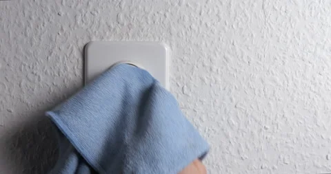 Dimmer button cleaning with man hand close up Stock Footage 148894805