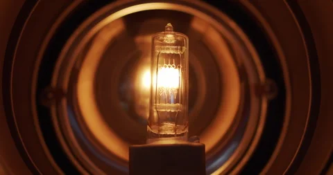 Dimming Incandescent Light Bulb Inside a Vintage Fresnel Mole 1K Pro Res 422HQ Stock Footage 244004030