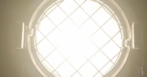 Dimming Light Bulb Inside a Vintage Fresnel Mole 1K Pro Res 422HQ Stock Footage 244004319
