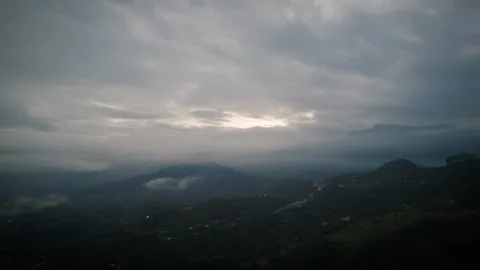 Dimming Twilight Over Misted Ridges With Pinpoint Settlement Glow Stock Footage 316864715