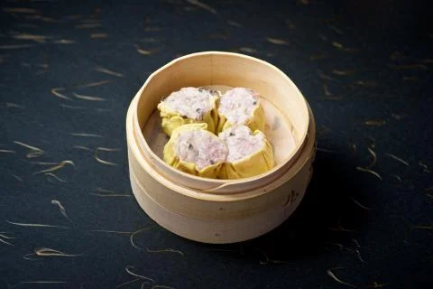 Dimsum in bamboo container Stock Photos