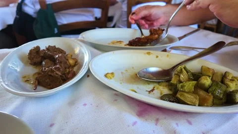 Diner Serving Stewed Meat and Zucchini at a Restaurant Stock Footage 345485236