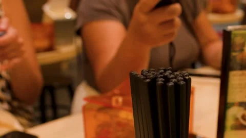 Diner Taking Chopsticks from Table Holder in Asian Restaurant Stock Footage 346587710