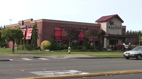 Diners Enter An Applebee's Restaurant Stock Footage 54669220