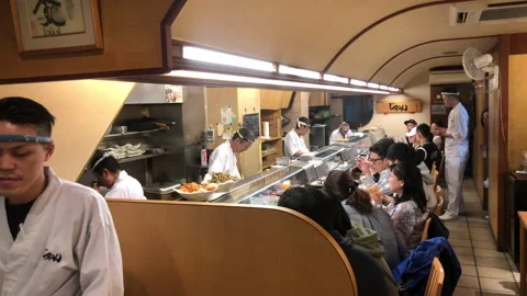 Diners inside a Japanese restaurant Stock Footage 131441954