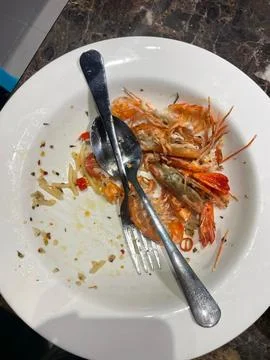 Diners Leave Prawn Pasta Shells On Plate Stock Photos