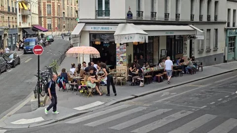 Diners Relaxing At A Busy Pavement Cafe Terrace On A Paris Street Corner Stock Footage 342775905