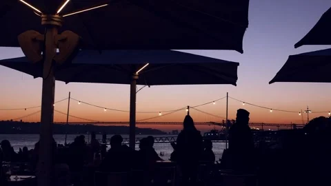 Diners sitting at a cafe overlooking in Lisbon, Portugal Stock Footage 168127569