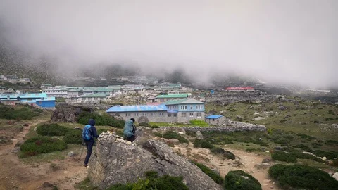 DINGBOCHE, NEPAL - 13 SEPTEMBER 2017 :Two Trekkers Walking to Dingboche Villa Stock Footage 85622692