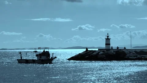Dinghy and lighthouse sunset Stock Footage 263670931