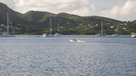 Dinghy passing through the bay Stock Footage 149215873