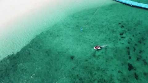 Dinghy with people goes to the beach Stock Footage 146271453