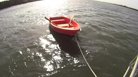 Dinghy Row Boat With Sun Behind Stock-Footage 43677282