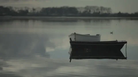 Dinghy sitting in flat calm harbour 2 스톡 동영상 34291574