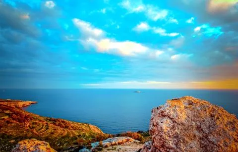 Dingli Cliffs with its view to the little islet of Filfla Stock Photos