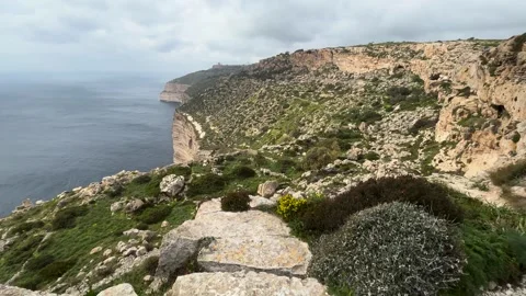 Dingli cliffs stretch along malta coastline sheer limestone rock face green Видео 343679618