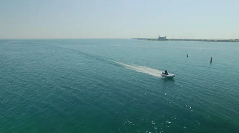 Dingy boat going through markers Stock Footage 63421862