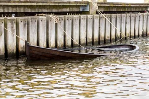 A dingy submerged Stock Photos