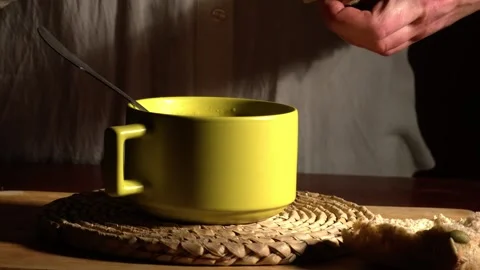 Dining alone dipping bread into a bowl of soup Video stock 258227440