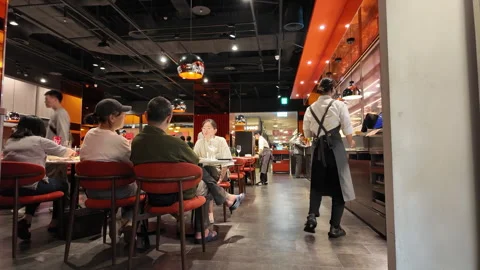 Dining Ambiance: Capturing a Busy Restaurant Scene Stock Footage 293030787