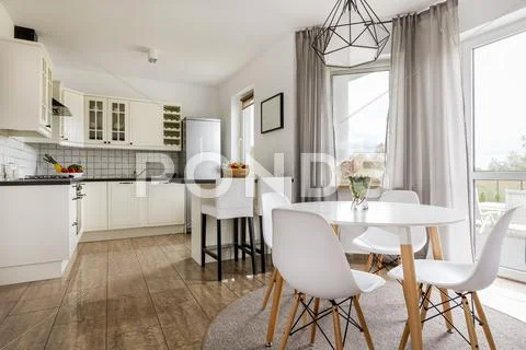 Dining area and kitchen combined Stock Photos
