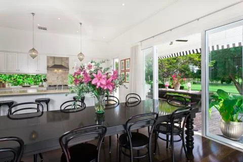 Dining area and kitchen overlooking a golf course Stock Photos